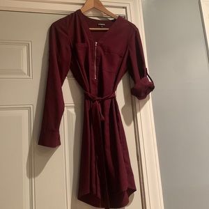 Burgundy v-neck long sleeve dress w/ breast pockets. Adjustable sleeves.